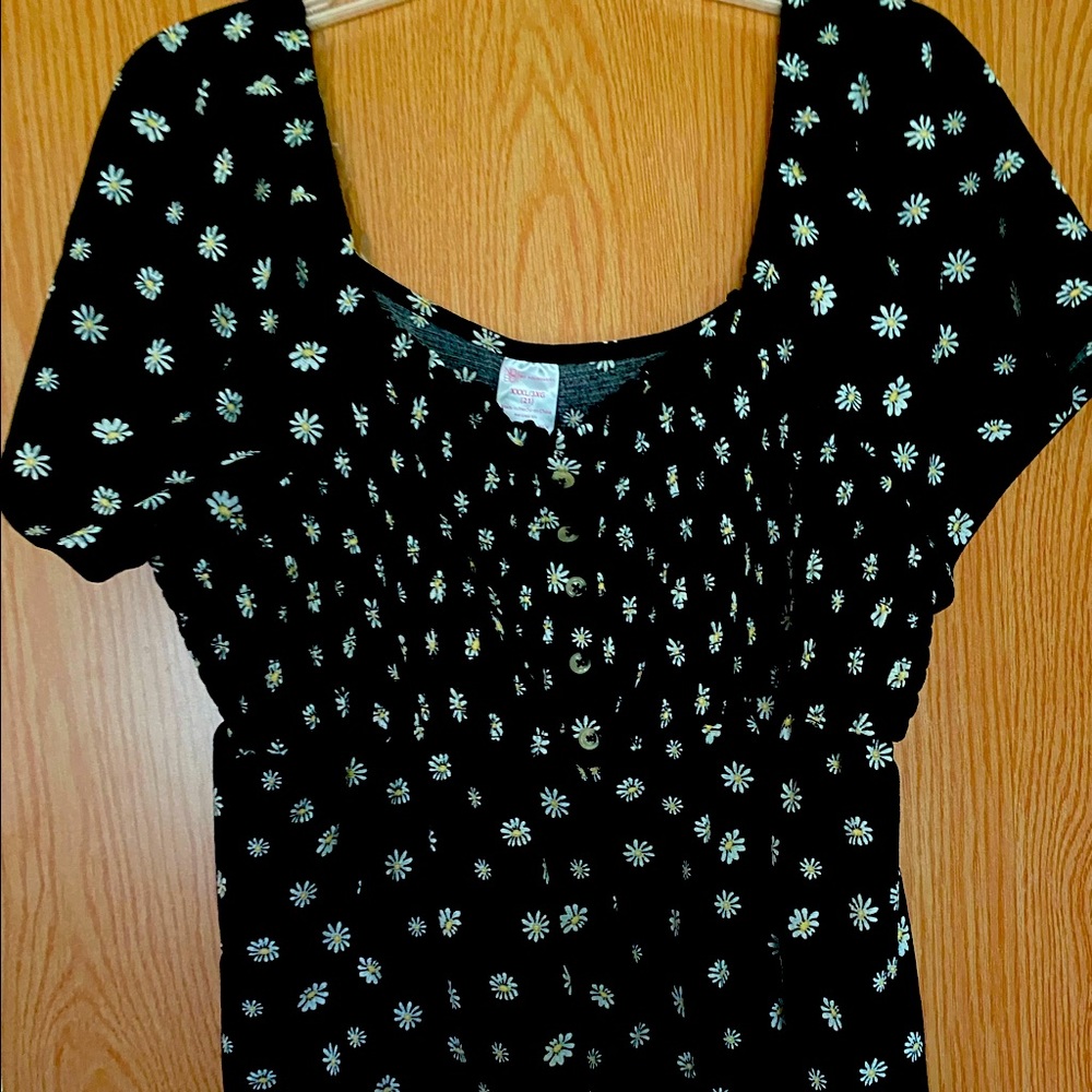 Cute off the shoulder daisy shirt.